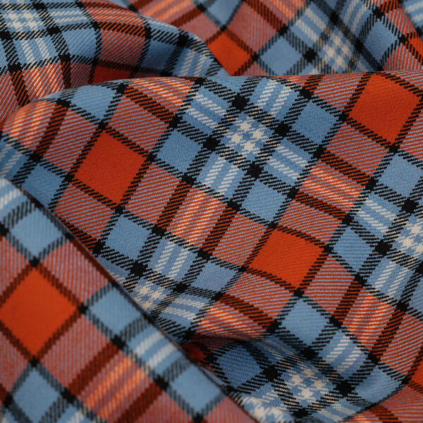 Spirit of Le Mans (SOLM) "Racing" tartan fabric in blue & orange is one of the most famous motorsport livery colors in history.
