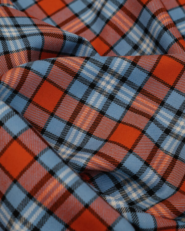 Spirit of Le Mans (SOLM) "Racing" tartan fabric in blue & orange is one of the most famous motorsport livery colors in history.